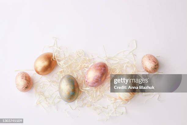 colorful easter eggs over pastel white background. greeting card for holidays. - easter flowers stock pictures, royalty-free photos & images