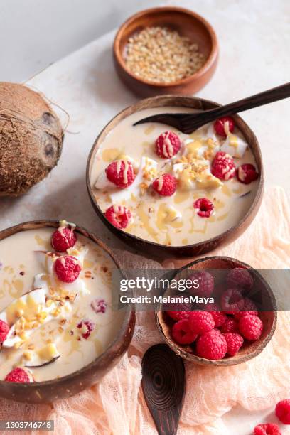 Healthy Coconut Smoothie Bowl With Raspberries High-Res Stock Photo