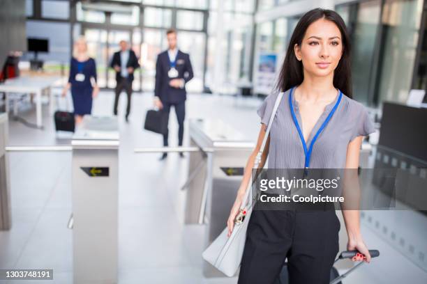 multiethnic group of businesspeople attending a conference - entering turnstile stock pictures, royalty-free photos & images