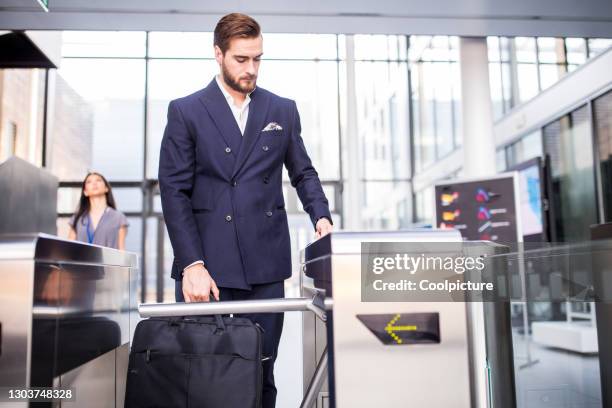 multiethnic group of businesspeople attending a conference - entering turnstile stock pictures, royalty-free photos & images