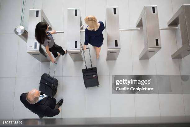 multiethnic group of businesspeople attending a conference - entering turnstile stock pictures, royalty-free photos & images