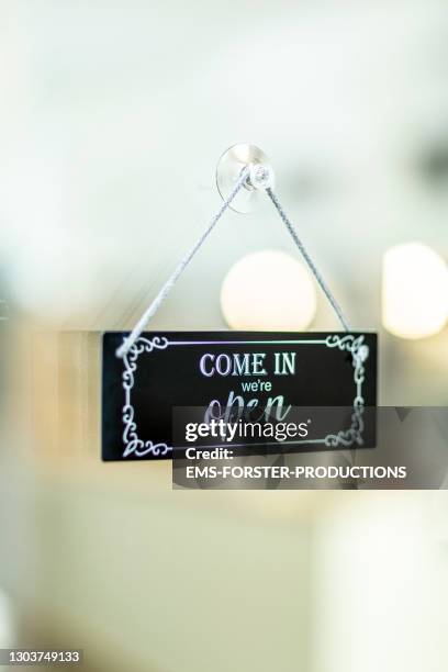 store open sign hanging on the window from pizzeria - restaurants open during lockdown stock pictures, royalty-free photos & images
