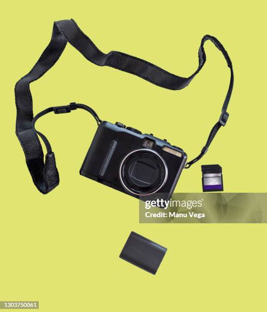 digital still camera on a yellow background. - digital camera stock pictures, royalty-free photos & images