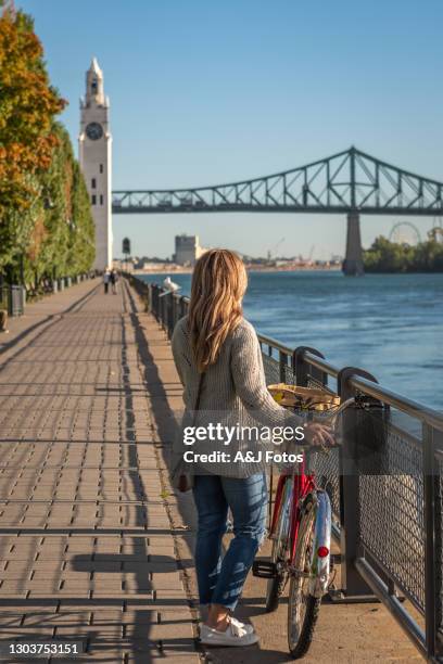 bike ride in montreal. - montreal clock tower stock pictures, royalty-free photos & images