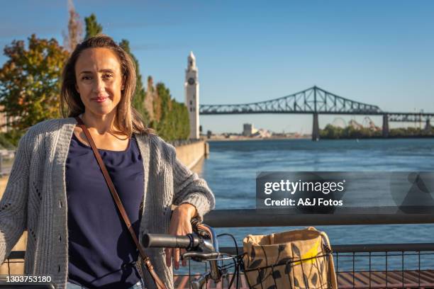 bike ride in montreal. - montreal clock tower stock pictures, royalty-free photos & images