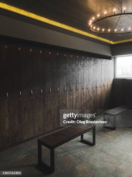 empty changing room in gym in morning with beautiful sun light from window - locker room wall stock pictures, royalty-free photos & images