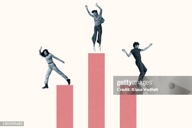 cheerful multi-ethnic friends jumping on pink columns - three people dancing stock pictures, royalty-free photos & images