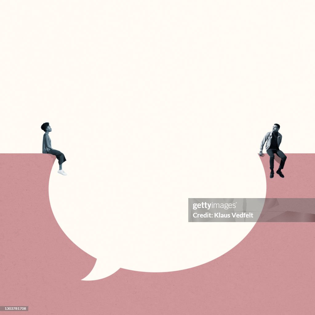 Man and woman sitting around large thought bubble