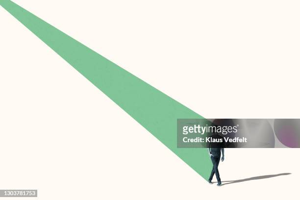 thoughtful man standing with green ray behind him - 20 20 vision bildbanksfoton och bilder