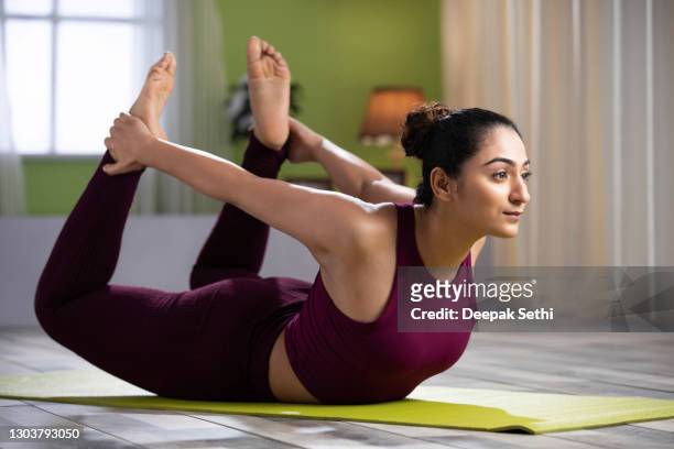 beautiful attractive young woman doing yoga exercising at home, health concept, fitness concept, stock photo - yoga stock pictures, royalty-free photos & images