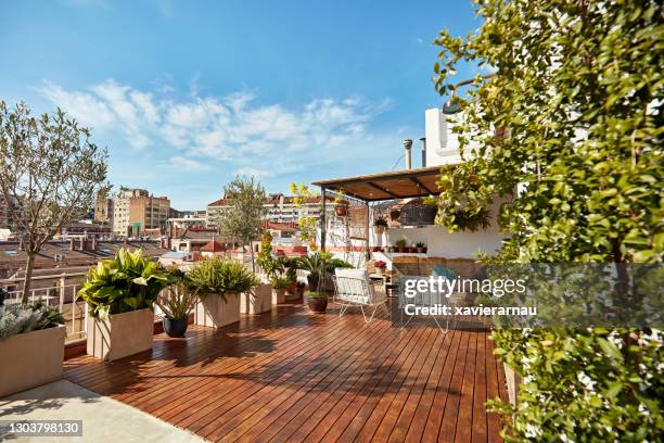 rooftop deck of modern barcelona apartment - rooftop garden stock pictures, royalty-free photos & images