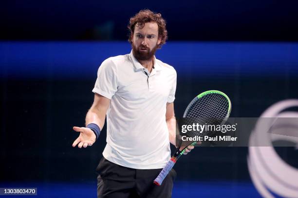 Ernests Gulbis of Latvia reacts in his Men's Singles first round match against Roberto Marcora of Italy on day three of the Singapore Tennis Open at...