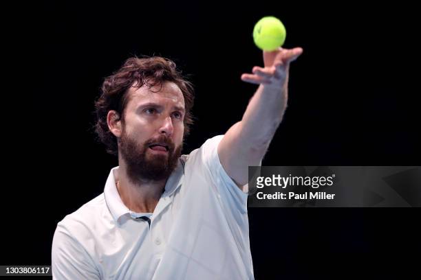 Ernests Gulbis of Latvia serves in his Men's Singles first round match against Roberto Marcora of Italy on day three of the Singapore Tennis Open at...