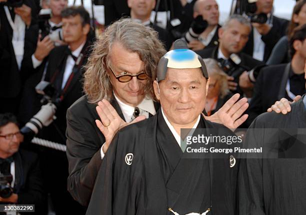Wim Wenders and Takeshi Kitano during 2007 Cannes Film Festival - "Chacun Son Cinema" All Directors Premiere at Palais des Festival in Cannes, France.