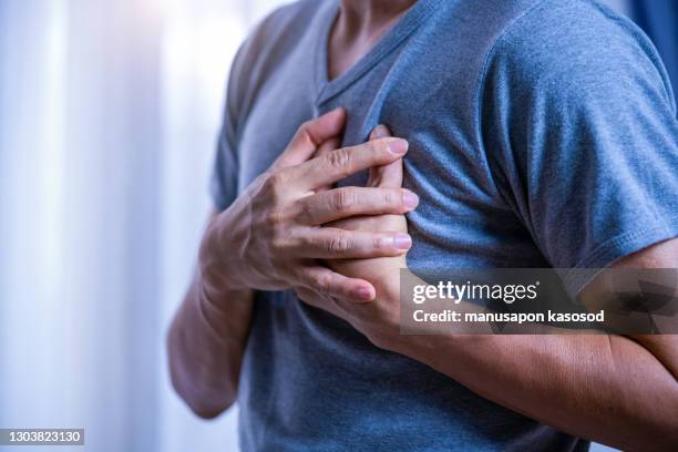 heart disease - man with chest pain stock pictures, royalty-free photos & images