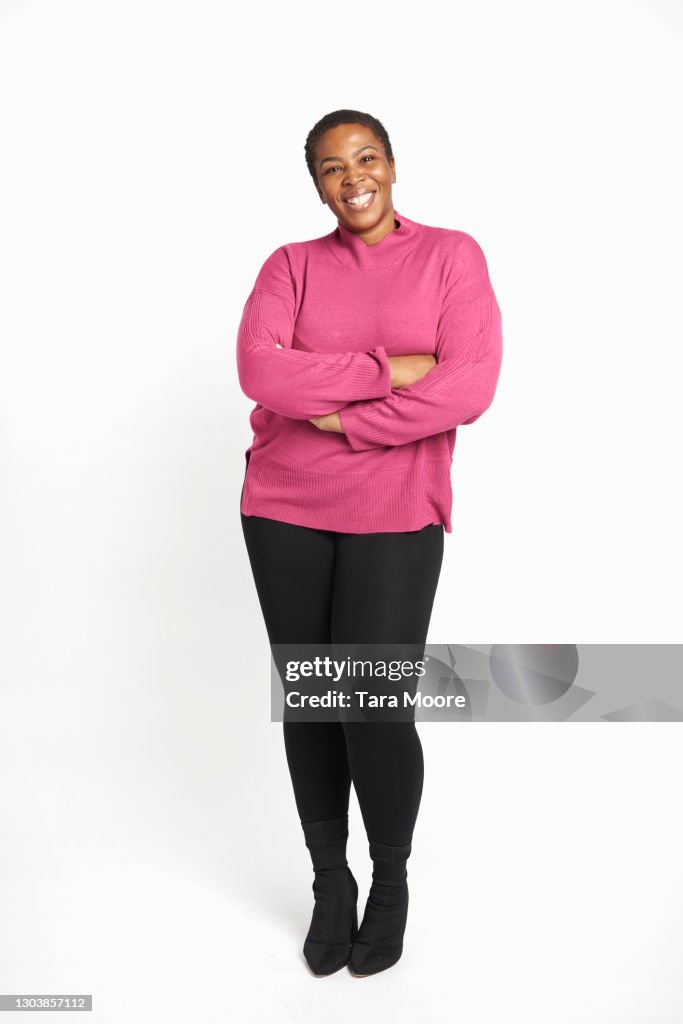 Full length of young woman smiling