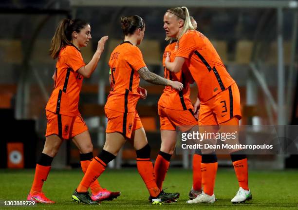 Jackie Groenen of Netherlands celebrates with Stephanie van der Gragt and team mates after scoring their side's first goal during the Three...