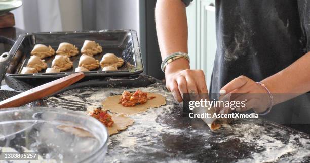 young woman makes empanadas at home in the morning - panama food stock pictures, royalty-free photos & images