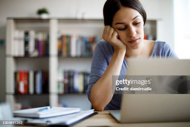 bored woman working from home - job search stress stock pictures, royalty-free photos & images