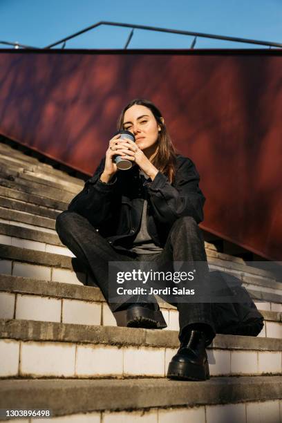 woman on a public park with a coffee mug - hot spanish women ストックフォトと画像