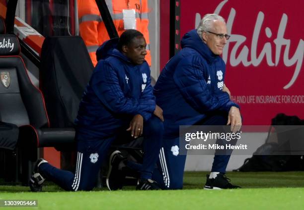 Terry Connor, Assistant Coach of Cardiff City and Mick McCarthy, Manager of Cardiff City take a knee in support of the Black Lives Matter movement...