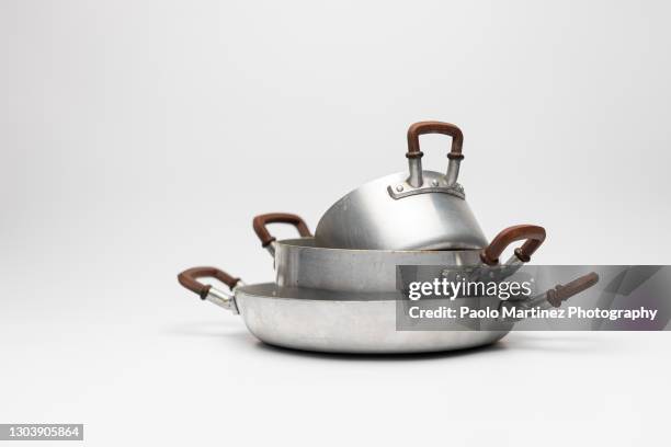 stack of aluminium pots - kochgeschirr stock-fotos und bilder