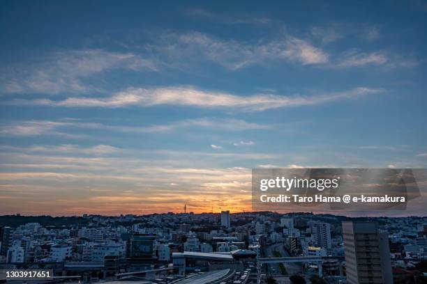 morning sunbeam on the residential district on the hill in naha city of japan - japan sunrise stock-fotos und bilder