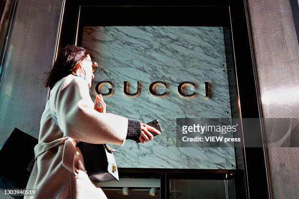 Woman walks in front of the Gucci store on Fifth Avenue in Trump Tower on February 24, 2021 in New York City. Gucci extended its lease in the Trump...