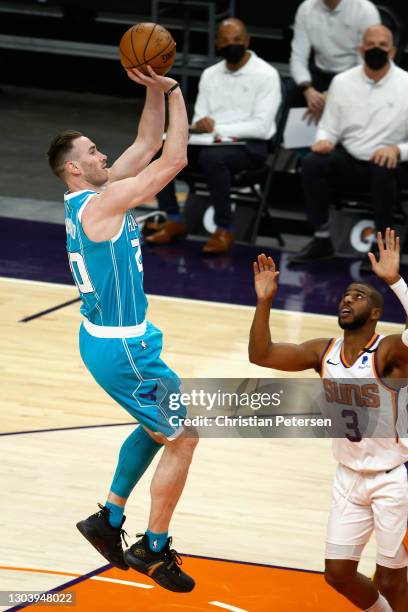 Gordon Hayward of the Charlotte Hornets attempts a shot over Chris Paul of the Phoenix Suns during the first half of the NBA game at Phoenix Suns...