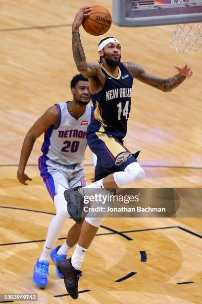 Brandon Ingram of the New Orleans Pelicans scores as Josh Jackson of the Detroit Pistons defends during the second half at the Smoothie King Center...