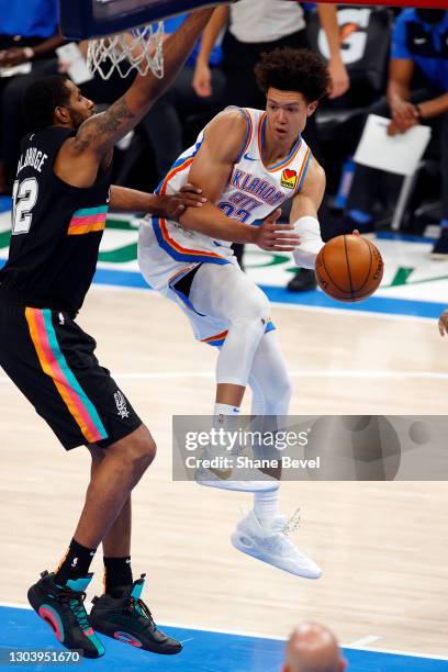 Isaiah Roby of the Oklahoma City Thunder passes against LaMarcus Aldridge of the San Antonio Spurs during the third quarter at Chesapeake Energy...