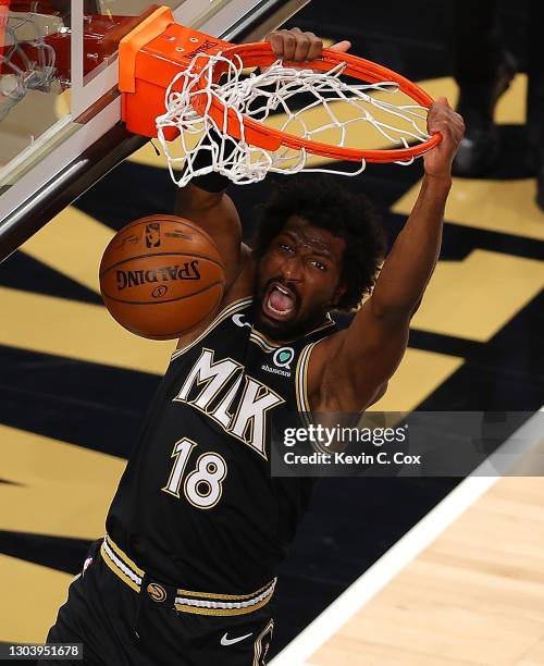 Solomon Hill of the Atlanta Hawks dunks against the Boston Celtics during the second half at State Farm Arena on February 24, 2021 in Atlanta,...