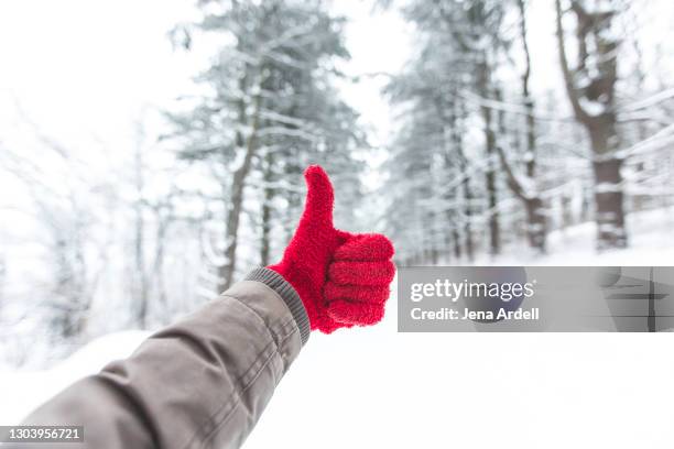happy winter thumbs up personal perspective - luva vermelha imagens e fotografias de stock