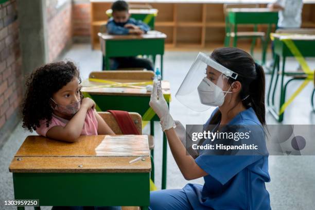 covid-19 vaccination day at school - global health stock pictures, royalty-free photos & images