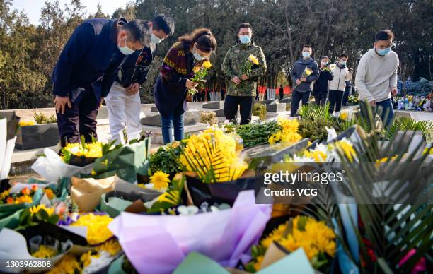 People pay respects to Chen Hongjun, one of the four martyrs who died during the border clash with India in June, at a martyrs cemetery on February...