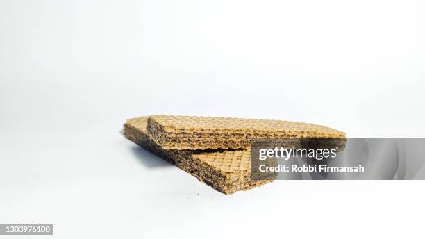 stack of two chocolate wafer on white background. - wafer stock pictures, royalty-free photos & images