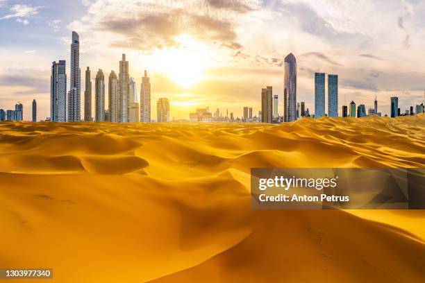 skyscrapers in the desert. the concept of globalization and global warming - doha desert stock pictures, royalty-free photos & images