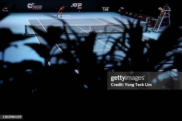 Yannick Hanfmann of Germany serves in his Men's Singles second round match against Radu Albot of Moldova on day four of the Singapore Tennis Open at...