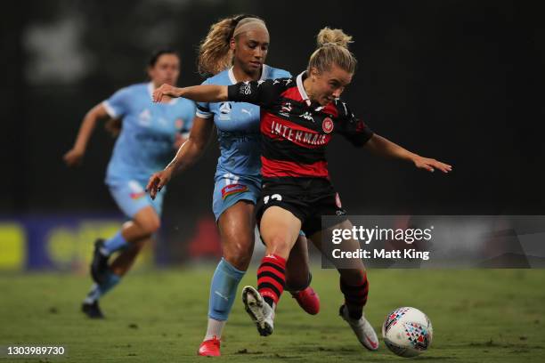 Georgia Yeoman-Dale of the Wanderers is challenged by Samantha Johnson of Melbourne City FC during the round 10 W-League match between the Western...