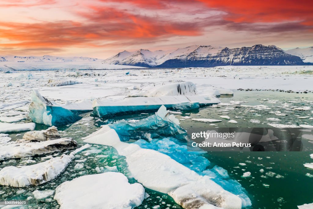Icebergs in Jokulsarlon glacial lagoon at sunset. Aerial view