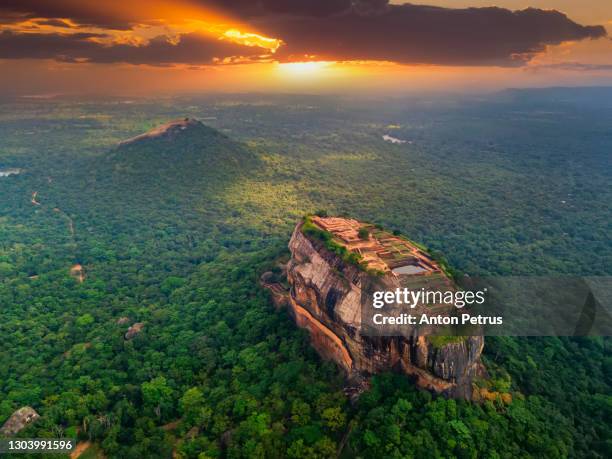 aerial view of sigiriya rock at sunset, sri lanka. drone photo. - sigiriya foto e immagini stock