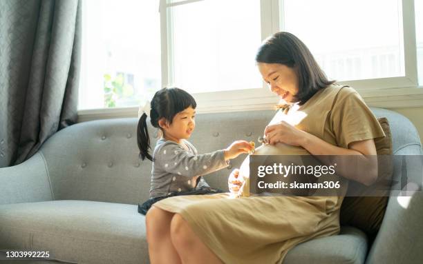 pregnant and happy moment - asian woman pregnant stock pictures, royalty-free photos & images