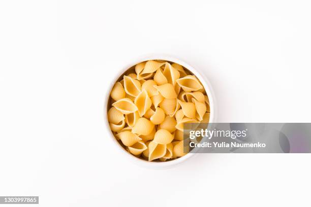 pasta on white background - carbohydrate food type stock pictures, royalty-free photos & images