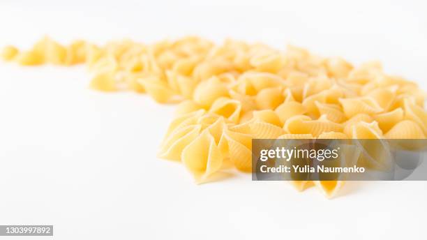 pasta on white background - carbohydrate food type stock pictures, royalty-free photos & images