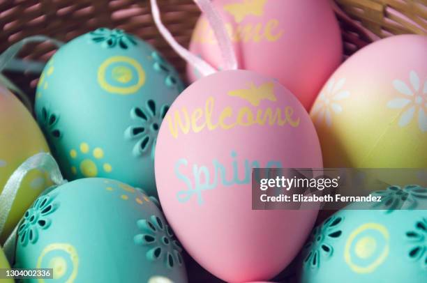 full frame of easter eggs in basket, high angle view - easter egg basket stock pictures, royalty-free photos & images