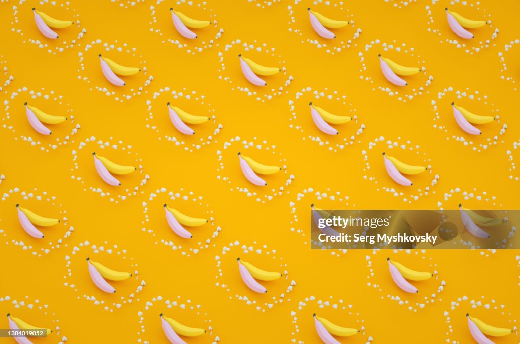 Purple and yellow banana on a yellow background pop art 3d render texture