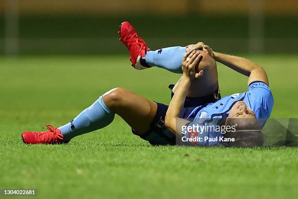 Ellie Brush of Sydney holds her right knee following an injury during the round 10 W-League match between the Perth Glory and the Sydney FC at...