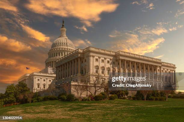 south wing (the house of representatives wing) of the us capitol building with orange, yellow and blue sunset sky, washington dc, usa. - house of representatives building stock pictures, royalty-free photos & images