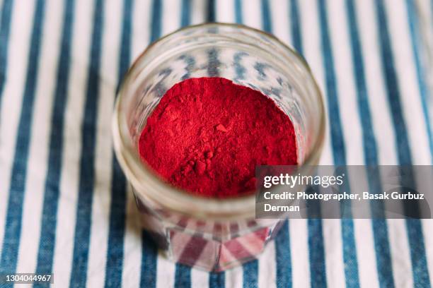 spice, beetroot powder in a glass jar - orange powder ストックフォトと画像