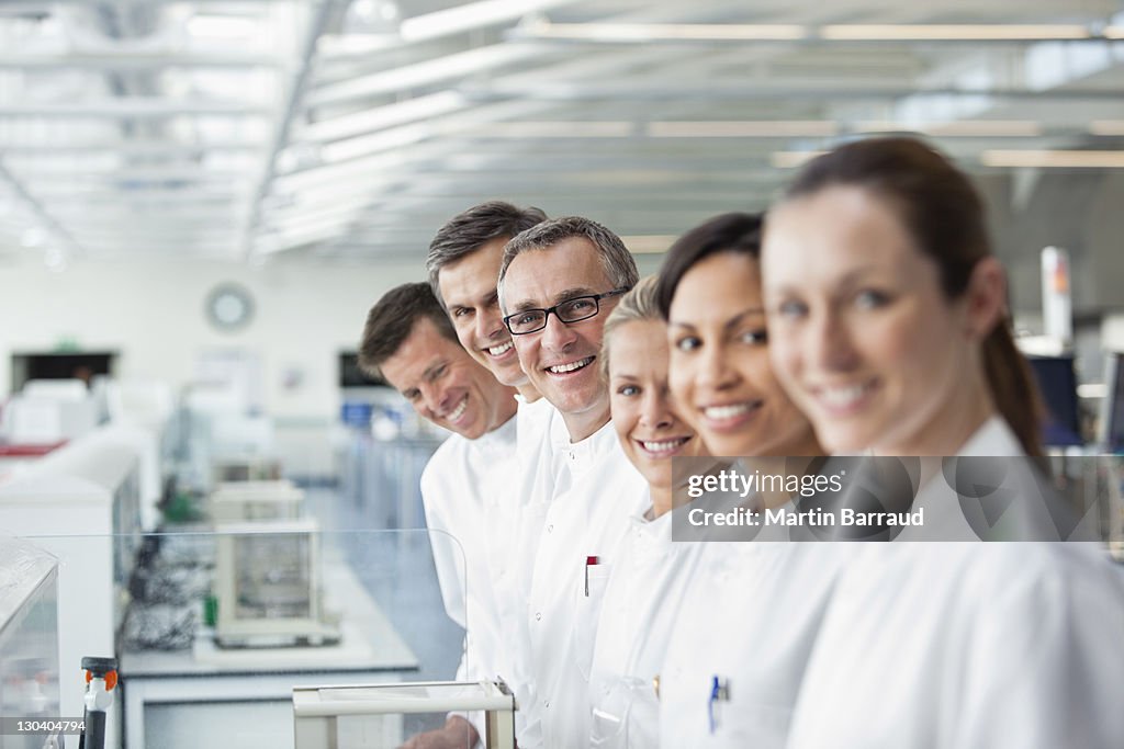 Scientists smiling together in lab